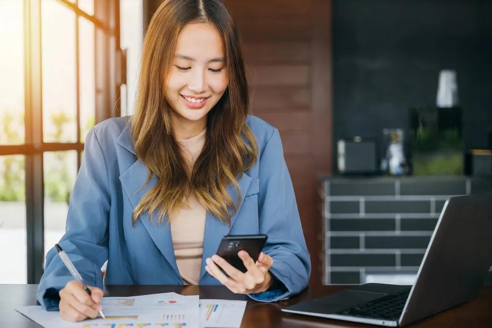 Real estate investor reviewing property investment data on a laptop