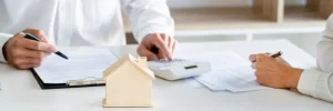 Investors analyzing short term rental profitability with property income documents